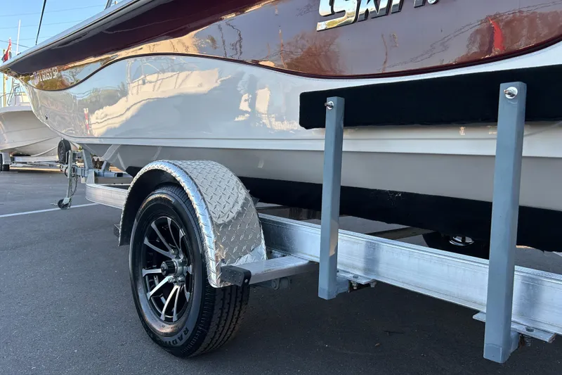 Slide: The Image of 2020 Carolina Skiff 21 LS boat on trailer, close-up of wheel and hull. - 17