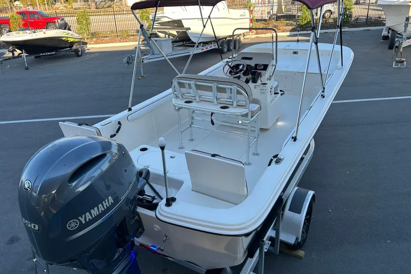 Slide: The Image of 2020 Carolina Skiff 21 LS boat with Yamaha engine, parked on a trailer. - 7