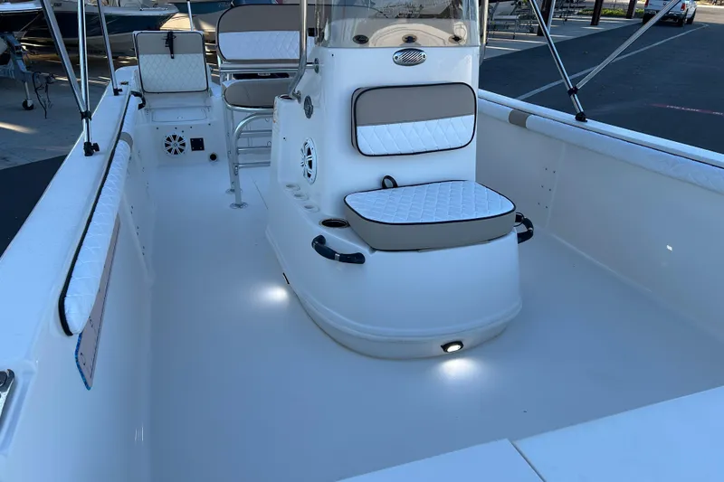 Slide: The Image of 2020 Carolina Skiff 21 LS boat interior with cushioned seating and modern design. - 9