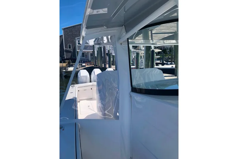 Slide: The Image of 2025 Valhalla Boatworks V-41, sleek design, docked under clear blue sky. - 10