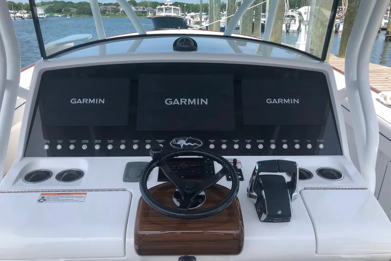 Slide: The Image of 2025 Valhalla Boatworks V-41 helm with Garmin displays and controls. - 6