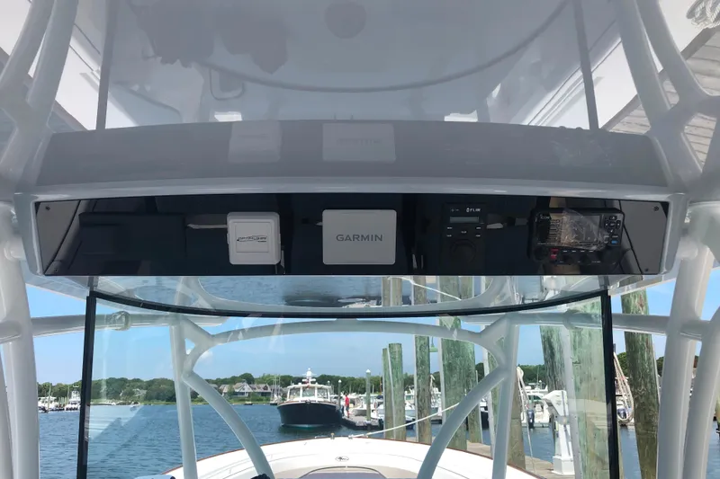 Slide: The Image of 2025 Valhalla Boatworks V-41 helm with Garmin electronics and marina view. - 8