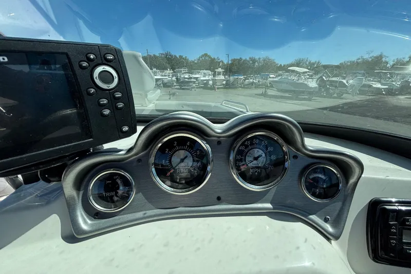 Slide: The Image of Dashboard of 2021 NauticStar 203 DC boat with gauges and navigation system. - 24