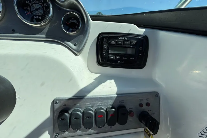 Slide: The Image of Dashboard of 2021 NauticStar 203 DC boat with gauges and control panel. - 26