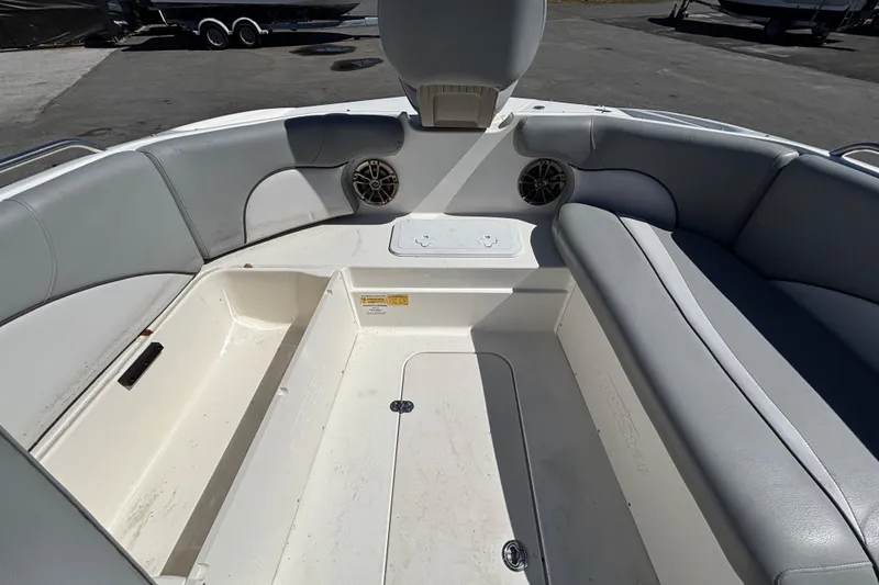 Slide: The Image of 2021 NauticStar 203 DC boat interior with spacious seating and storage compartments. - 34