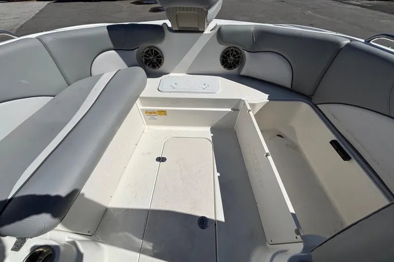Slide: The Image of Interior view of 2021 NauticStar 203 DC boat, featuring seating and storage compartments. - 35