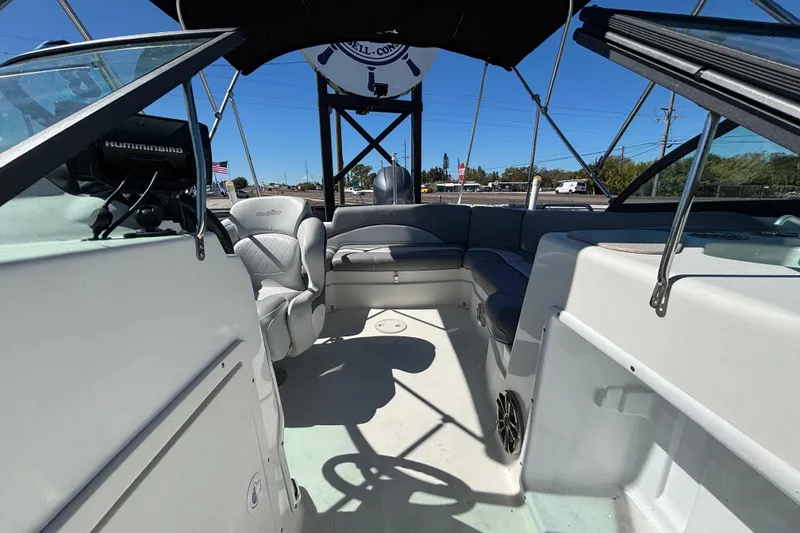Slide: The Image of 2021 NauticStar 203 DC boat interior with seating and steering console. - 47