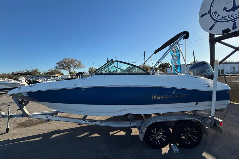 Slide: The Image of 2021 NauticStar 203 DC boat with Yamaha outboard motor on trailer. - 5