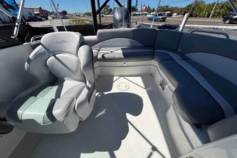 Slide: The Image of Interior of 2021 NauticStar 203 DC boat with gray seating and spacious layout. - 50