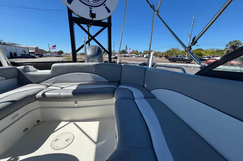Slide: The Image of 2021 NauticStar 203 DC boat interior with gray seating and open deck view. - 51