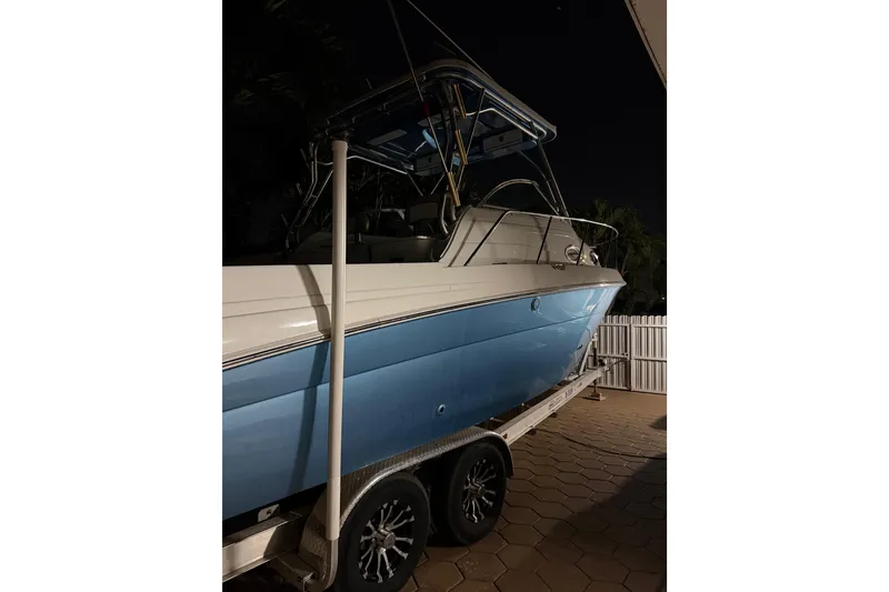 Slide: The Image of 2001 Wellcraft 270 Coastal O/B boat on trailer, parked at night. - 11