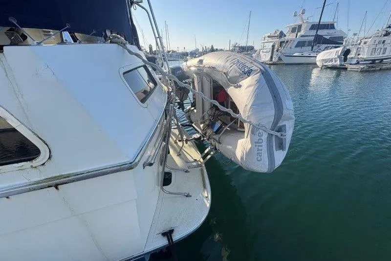 Slide: The Image of 1987 Tollycraft 34 Sundeck Motor Yacht docked at marina, side view. - 10