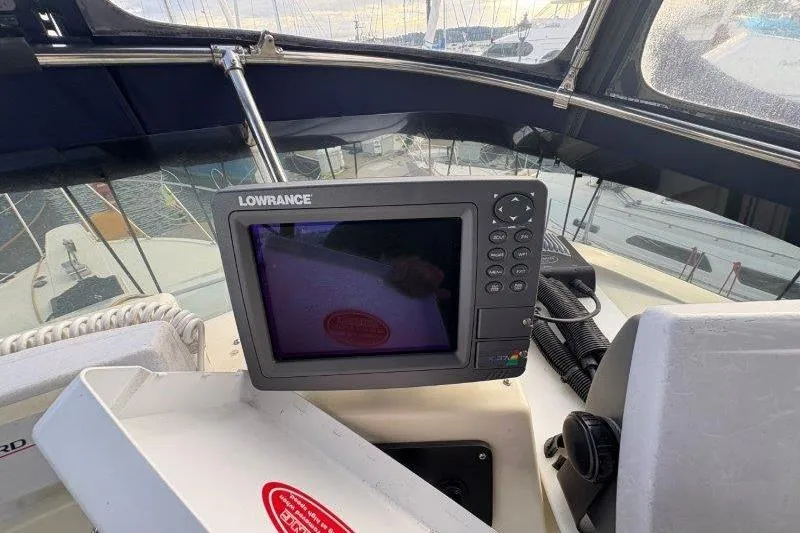 Slide: The Image of Control panel of 1987 Tollycraft 34 Sundeck Motor Yacht with Lowrance electronics. - 17