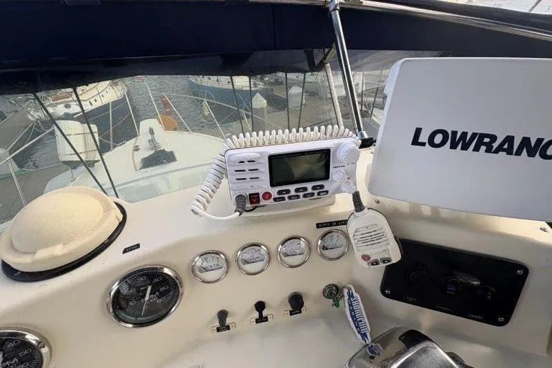 Slide: The Image of 1987 Tollycraft 34 Sundeck Motor Yacht with Lowrance navigation system on deck. - 18