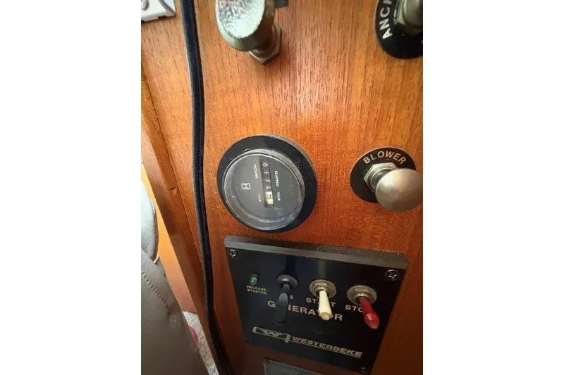 Slide: The Image of 1987 Tollycraft 34 Sundeck Motor Yacht helm with Garmin navigation system and controls. - 25