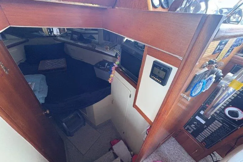 Slide: The Image of 1987 Tollycraft 34 Sundeck Motor Yacht dashboard with gauges and Garmin GPS. - 29