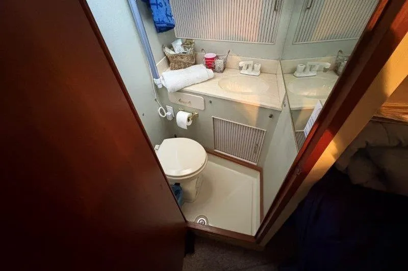 Slide: The Image of Interior of 1987 Tollycraft 34 Sundeck Motor Yacht with cozy bedding and decor. - 31