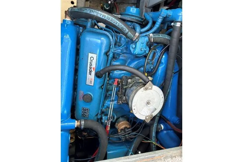 Slide: The Image of Interior of 1987 Tollycraft 34 Sundeck Motor Yacht with blue seating and wooden accents. - 46