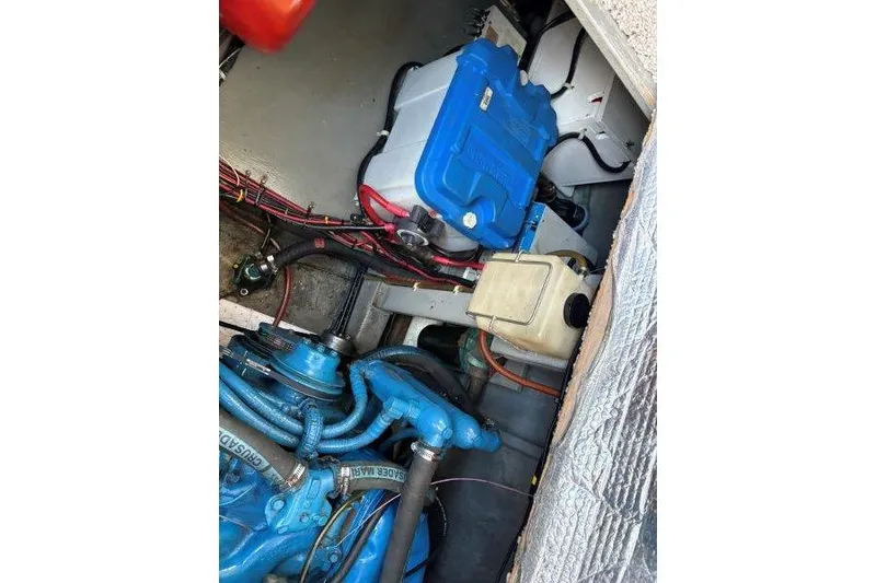 Slide: The Image of Engine of 1987 Tollycraft 34 Sundeck Motor Yacht, featuring blue Crusader components. - 48