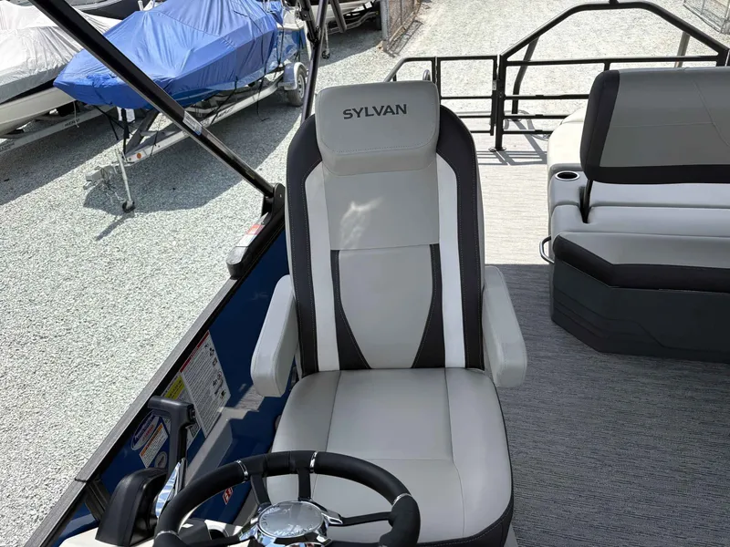 Slide: The Image of Sylvan X-5 CLZ DH 2026 boat seat and steering area. - 13