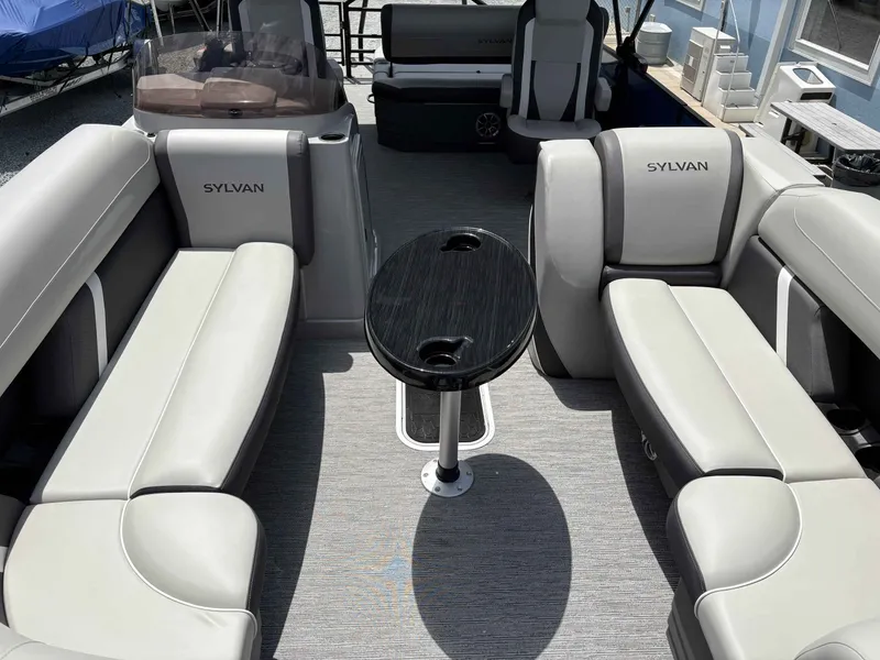 Slide: The Image of Interior of 2026 Sylvan X-5 CLZ DH with gray seating and table. - 6
