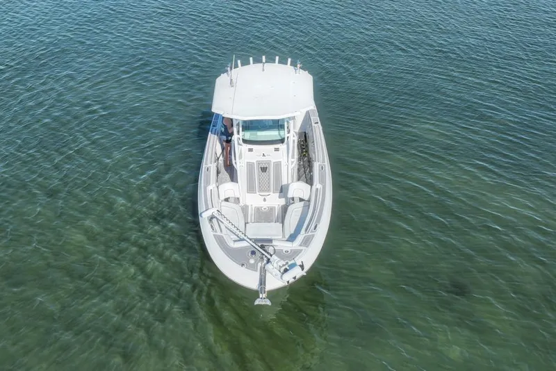Slide: The Image of 2021 Wellcraft 262 Fisherman boat on clear water, aerial view. - 17