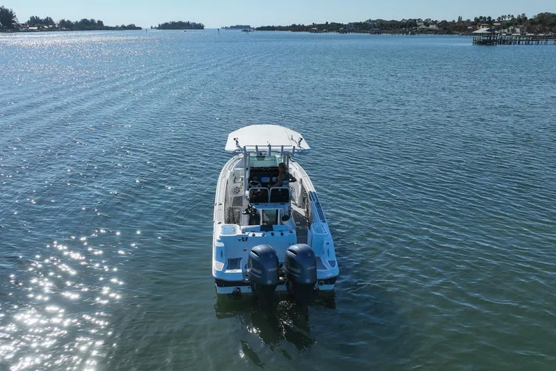 Slide: The Image of 2021 Wellcraft 262 Fisherman boat cruising on a sunny, calm sea. - 22