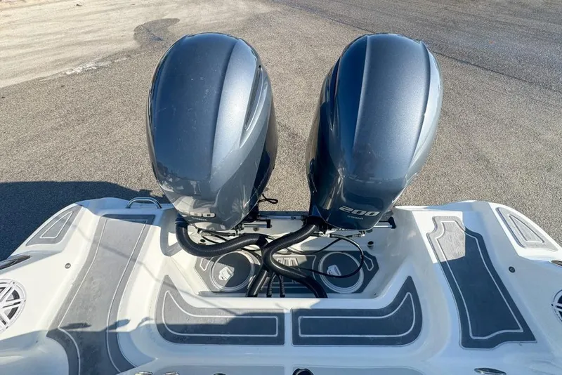 Slide: The Image of 2021 Wellcraft 262 Fisherman boat with dual 200 horsepower outboard engines. - 24