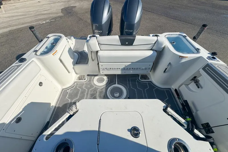 Slide: The Image of 2021 Wellcraft 262 Fisherman boat interior with dual engines and seating area. - 27