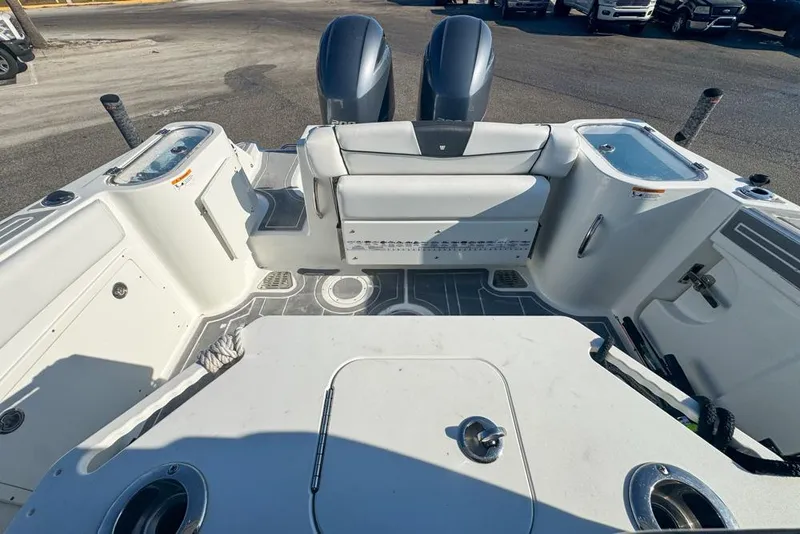 Slide: The Image of 2021 Wellcraft 262 Fisherman boat interior with dual engines and seating area. - 28