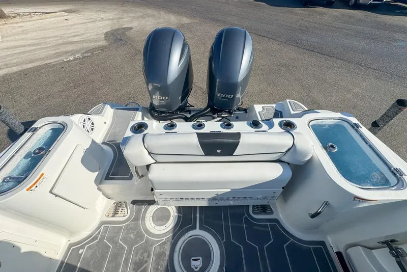 Slide: The Image of 2021 Wellcraft 262 Fisherman boat with dual 200 horsepower engines, rear deck view. - 30