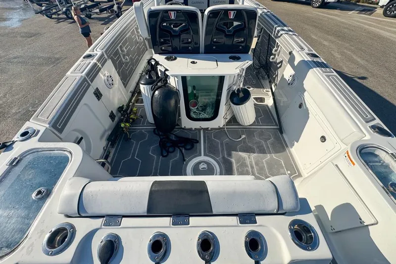 Slide: The Image of 2021 Wellcraft 262 Fisherman boat interior with seating, storage, and fishing equipment. - 38