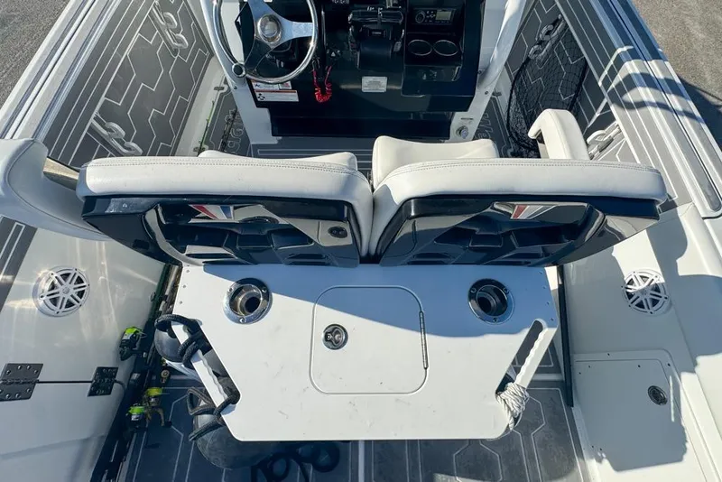 Slide: The Image of 2021 Wellcraft 262 Fisherman boat interior with dual seats and steering console. - 45