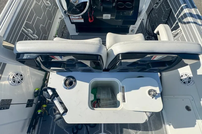 Slide: The Image of 2021 Wellcraft 262 Fisherman boat interior with seating and storage compartments. - 46