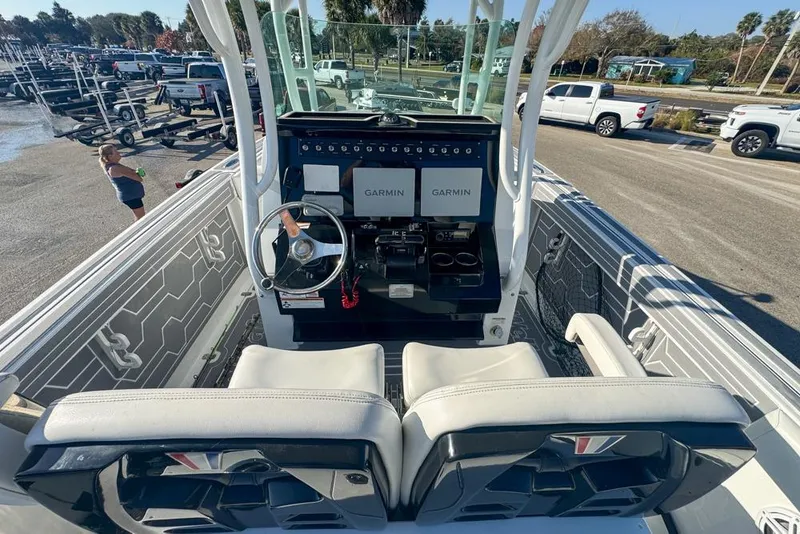 Slide: The Image of 2021 Wellcraft 262 Fisherman boat interior with Garmin navigation system and dual seating. - 48