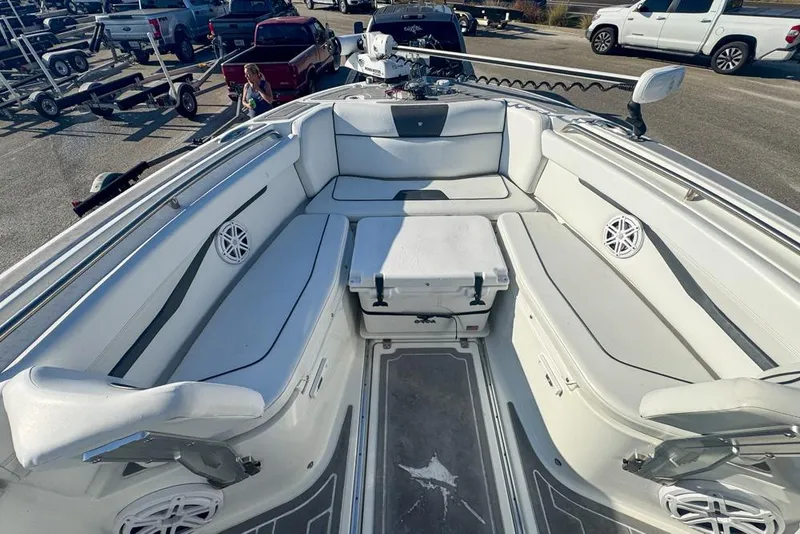 Slide: The Image of 2021 Wellcraft 262 Fisherman boat interior with seating and storage, parked in a lot. - 61