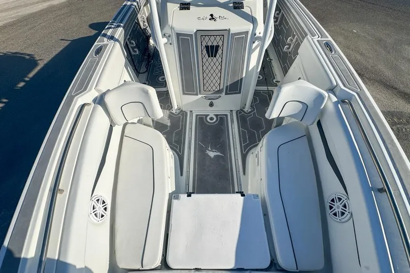 Slide: The Image of 2021 Wellcraft 262 Fisherman boat interior with cushioned seating and storage compartments. - 67