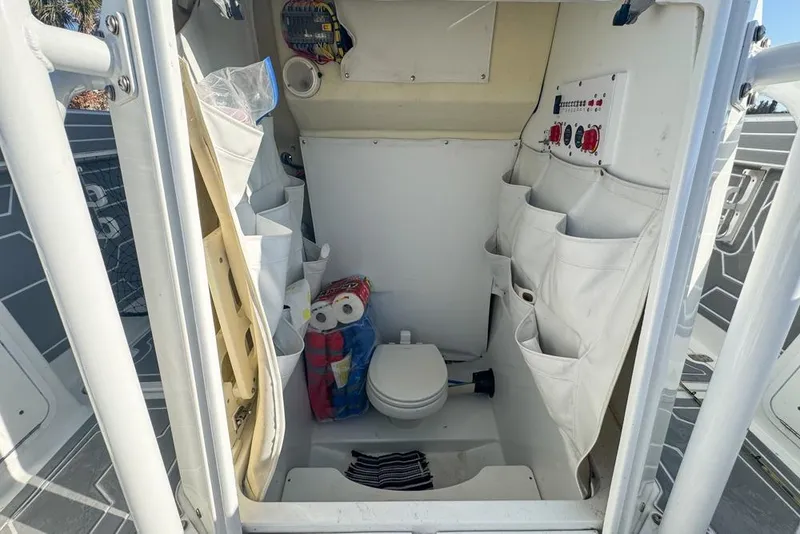 Slide: The Image of Interior of 2021 Wellcraft 262 Fisherman boat with storage and toilet. - 77