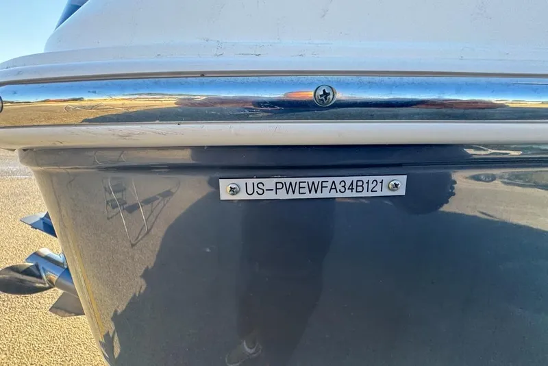 Slide: The Image of 2021 Wellcraft 262 Fisherman boat with visible hull identification number. - 93