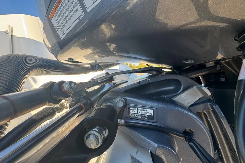 Slide: The Image of Close-up of Yamaha F200XB engine on 2021 Wellcraft 262 Fisherman boat. - 95