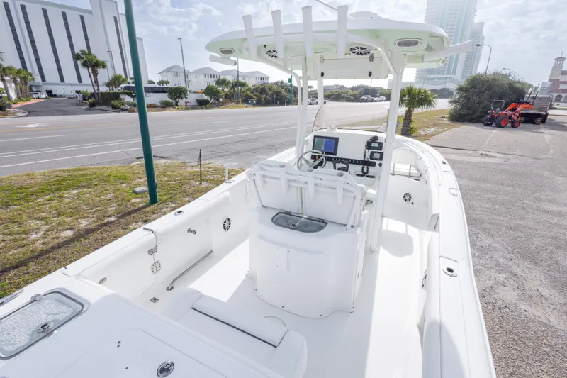 Slide: The Image of 2016 Sea Hunt Gamefish 25 boat with center console and modern navigation equipment. - 11