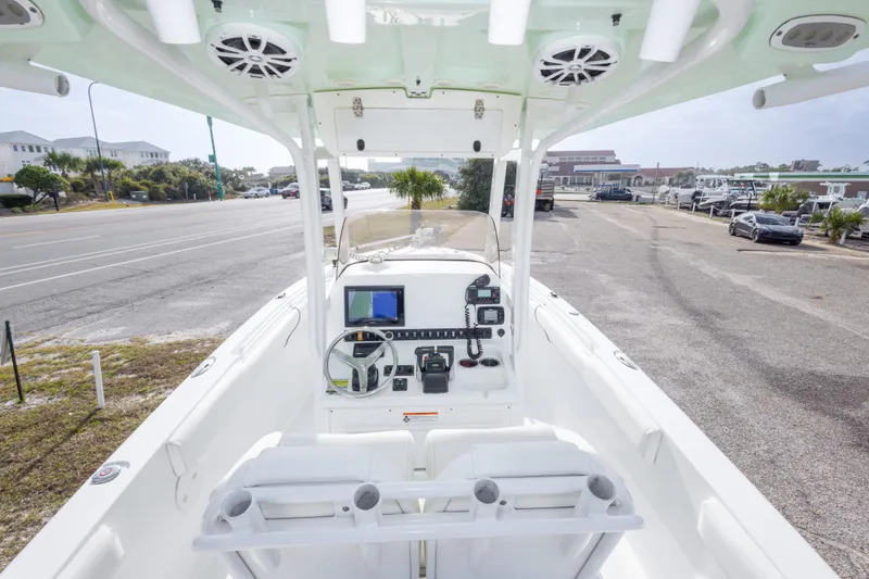 Slide: The Image of 2016 Sea Hunt Gamefish 25 boat interior with steering console and navigation equipment. - 13