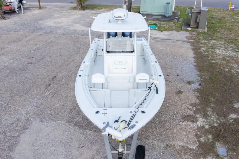 Slide: The Image of 2016 Sea Hunt Gamefish 25 boat on trailer, aerial view, featuring Garmin equipment. - 35