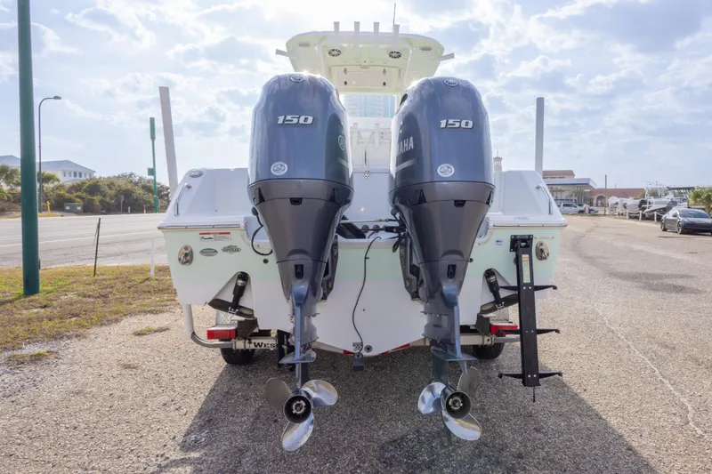 Slide: The Image of 2016 Sea Hunt Gamefish 25 with dual Yamaha 150 engines, parked on a sunny day. - 6
