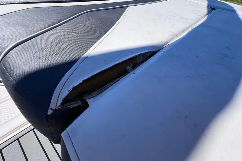 Slide: The Image of Damaged upholstery on 2015 Sea Ray 21 SPX OB boat seat. - 15