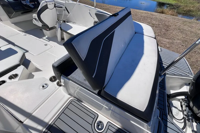 Slide: The Image of 2015 Sea Ray 21 SPX OB boat interior with seating and steering wheel. - 16