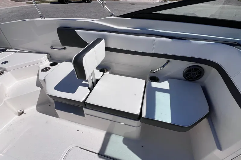 Slide: The Image of 2015 Sea Ray 21 SPX OB boat interior with white seating and cup holders. - 20