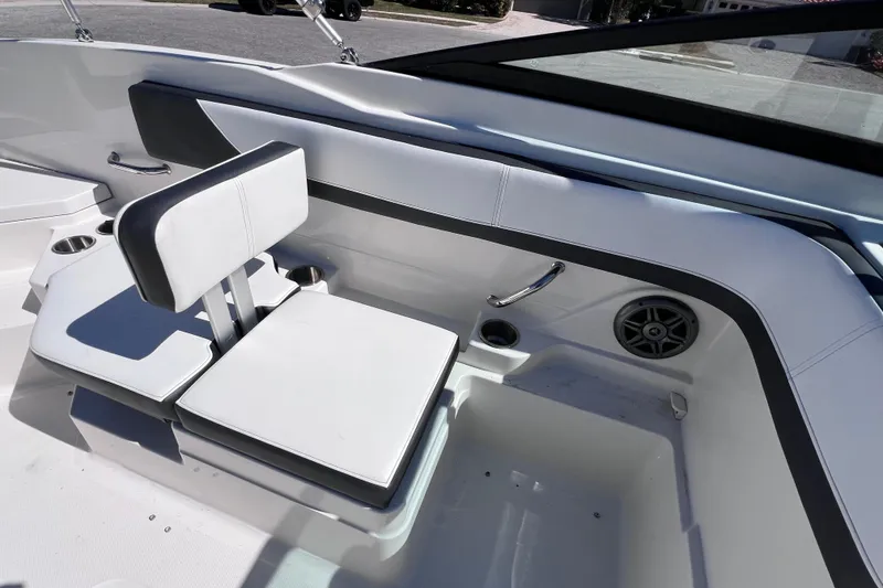 Slide: The Image of Interior of 2015 Sea Ray 21 SPX OB boat with white seating and cup holders. - 21