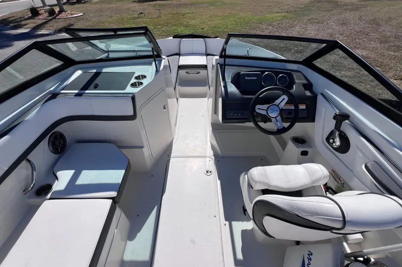 Slide: The Image of 2015 Sea Ray 21 SPX OB boat interior with steering wheel and seating. - 29