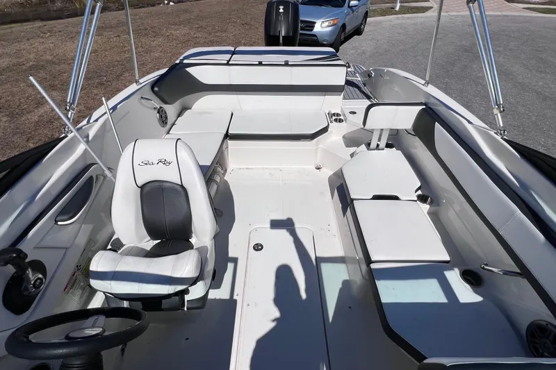 Slide: The Image of 2015 Sea Ray 21 SPX OB boat interior with seating and steering wheel. - 36